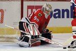 CHICAGO, IL - DECEMBER 21: Corey Crawford #50 of the Chicago Blackhawks makes a save against the Montreal Canadiens at the United Center on December 21, 2011 in Chicago, Illinois. (Photo by Jonathan Daniel/Getty Images)