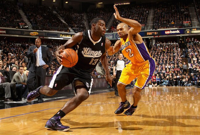 SACRAMENTO, CA - DECEMBER 26:  Tyreke Evans #13 of the Sacramento Kings drives on Derek Fisher #2 of the Los Angeles Lakers at Power Balance Pavilion on December 26, 2011 in Sacramento, California.  NOTE TO USER: User expressly acknowledges and agrees that, by downloading and or using this photograph, User is consenting to the terms and conditions of the Getty Images License Agreement.  (Photo by Ezra Shaw/Getty Images)