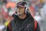 TAMPA, FL - NOVEMBER 30:  Coach Jon Gruden of the Tampa Bay Buccaneers checks the scoreboard against the New Orleans Saints at Raymond James Stadium on November 30, 2008 in Tampa, Florida.  (Photo by Al Messerschmidt/Getty Images)
