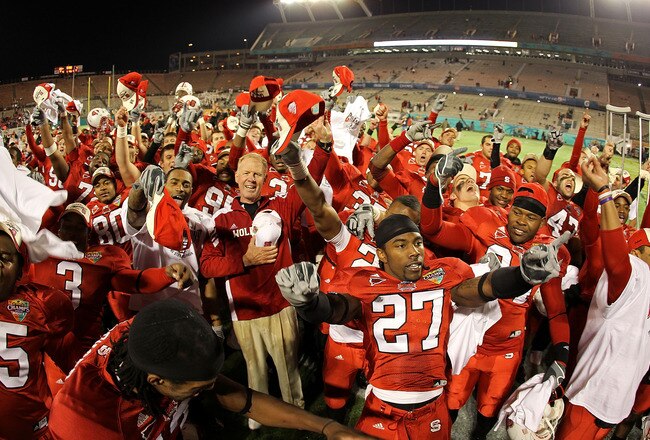 ORLANDO, FL - DECEMBER 28:  North Carolina State Wolfpack head coach Tom O'Brien celebrates after winning  the Champs Sports Bowl against the West Virginia Mountineers at Florida Citrus Bowl Stadium on December 28, 2010 in Orlando, Florida.  (Photo by Mike Ehrmann/Getty Images)