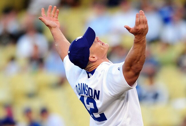 LOS ANGELES, CA - AUGUST 20: WWE Superstar John Cena throws the ceremonial first pitch for the Los Angeles Dodgers as they play the Chicago Cubs on August 20, 2009 at Dodger Stadium in Los Angeles, California. (Photo by Jacob de Golish/Getty Images)