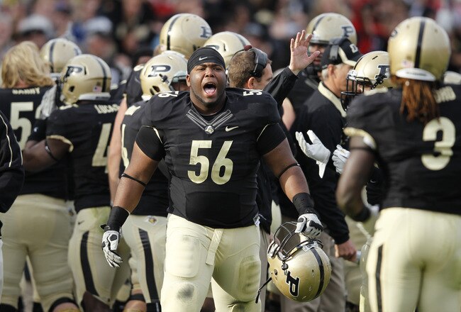 WEST LAFAYETTE, IN - NOVEMBER 12: Eric McDaniel #56 of the Purdue Boilermakers celebrates with teammates after the defense blocked an extra point attempt in the fourth quarter against the Ohio State Buckeyes at Ross-Ade Stadium on November 12, 2011 in West Lafayette, Indiana. Purdue defeated Ohio State 26-23 in overtime. (Photo by Joe Robbins/Getty Images)