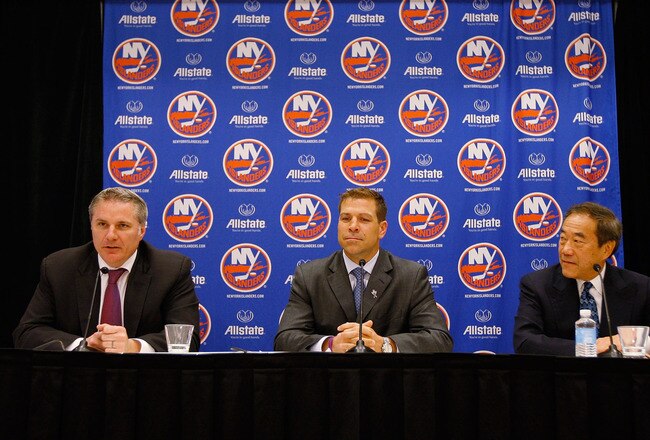 UNIONDALE, NY - MAY 26:  (L-R) General Manager Garth Snow, New York Islanders Captain Doug Weight and New York Islanders Owner Charles Wang speak to the media during a press conference to announce Doug Weight's retirement on May 26, 2011 at the Long Island Marriott in Uniondale, New York.  (Photo by Mike Stobe/NHLI via Getty Images)