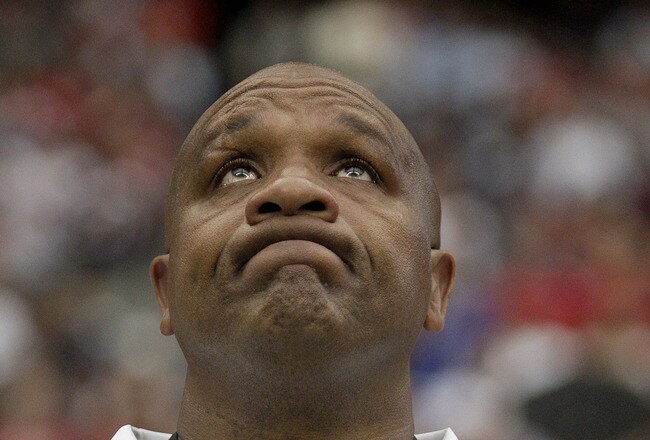 HOUSTON, TX - OCTOBER 09:  Head coach Hue Jackson of the Oakland Raiders try to hold back tears during a moment of silence for Oakland Raiders owner, Al Davis as the Raiders are to play the Houston Texans on October 9, 2011 at Reliant Stadium in Houston, Texas. Raider owner, Al Davis died at age 82 at his home Saturday morning.(Photo by Thomas B. Shea/Getty Images)
