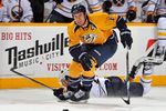 NASHVILLE, TN - DECEMBER 03: Shea Weber #6 of the Nashville Predators skates past a falling Thomas Vanek #26 of the Buffalo Sabres at the Bridgestone Arena on December 3, 2011 in Nashville, Tennessee.  (Photo by Frederick Breedon/Getty Images)