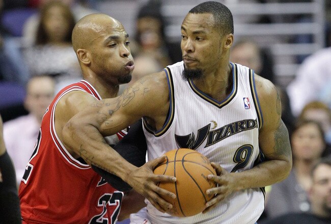 WASHINGTON, DC - FEBRUARY 28: Taj Gibson #22 of the Chicago Bulls guards Rashard Lewis #9 of the Washington Wizards at the Verizon Center in Washington on February 28, 2011 in Washington, DC. NOTE TO USER: User expressly acknowledges and agrees that, by downloading and/or using this Photograph, User is consenting to the terms and conditions of the Getty Images License Agreement.  (Photo by Rob Carr/Getty Images)