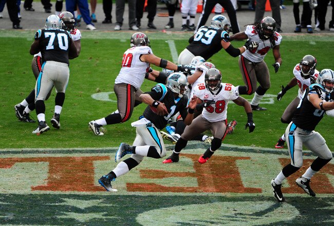 CHARLOTTE, NC - DECEMBER 24: Cam Newton #1 of the Carolina Panthers runs for a 49 yard touchdown against the Tampa Bay Buccaneers at Bank of America Stadium on December 24, 2011 in Charlotte, North Carolina  (Photo by Scott Cunningham/Getty Images)