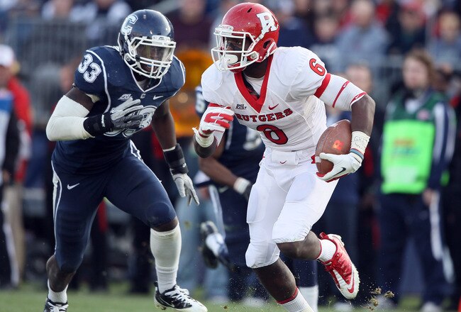 EAST HARTFORD, CT - NOVEMBER 26: Mohamed Sanu #6 of the Rutgers Scarlet Knights carries the ball as Yawin Smallwood #33 of the Connecticut Huskies defends on November 26, 2011 at Rentschler Field in East Hartford, Connecticut. The Connecticut Huskies defeated the Rutgers Scarlet Knights 40-22.  (Photo by Elsa/Getty Images)