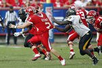 HOUSTON - DECEMBER 03:  Quarterback Case Keenum #7 of the Houston Cougars is sacked by Cordarro Law #49 of the Southern Miss Golden Eagles in the fourth quarter at Robertson Stadium on December 3, 2011 in Houston, Texas.  (Photo by Bob Levey/Getty Images)