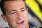 DAYTONA BEACH, FL - FEBRUARY 19:  A.J. Allmendinger, driver of the #43 Best Buy Ford, looks on in the garage area during practice for the NASCAR Sprint Cup Series Daytona 500 at Daytona International Speedway on February 19, 2011 in Daytona Beach, Florida.  (Photo by Jamie Squire/Getty Images)