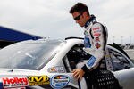 DAYTONA BEACH, FL - JULY 01:  Aric Almirola, driver of the #88 Suave Men Chevrolet, climbs into his car during qualifying for the NASCAR Nationwide Series Subway Jalapeno 250 Powered by Coca-Cola at Daytona International Speedway on July 1, 2011 in Daytona Beach, Florida.  (Photo by Mike Ehrmann/Getty Images for NASCAR)