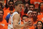 CHAMPAIGN, IL - DECEMBER 03:  Meyers Leonard #12 of the Illinois Fighting Illini looks to pass against Robert Sacre #00 of the Gonzaga Bulldogs at Assembly Hall on December 3, 2011 in Champaign, Illinois. Illinois defeated Gonzaga 82-75.  (Photo by Jonathan Daniel/Getty Images)