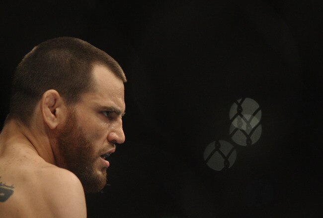 SYDNEY, AUSTRALIA - FEBRUARY 27:  Jon Fitch of the USA looks across the octagon at BJ Penn of the USA before the start of their welterweight bout part of UFC 127 at Acer Arena on February 27, 2011 in Sydney, Australia.  (Photo by Mark Kolbe/Getty Images)