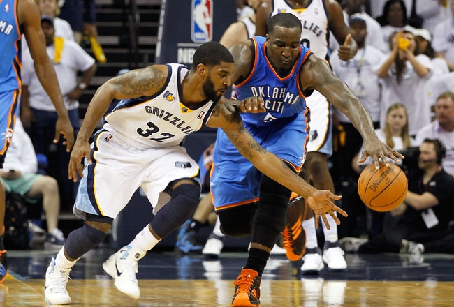 MEMPHIS, TN - MAY 13:  O.J. Mayo #32 of the Memphis Grizzlies battles for a loose ball against Kendrick Perkins #5 of the Oklahoma City Thunder in Game Six of the Western Conference Semifinals in the 2011 NBA Playoffs at FedExForum on May 13, 2011 in Memphis, Tennessee.  NOTE TO USER: User expressly acknowledges and agrees that, by downloading and/or using this photograph, User is consenting to the terms and conditions of the Getty Images License Agreement.  (Photo by Kevin C. Cox/Getty Images)