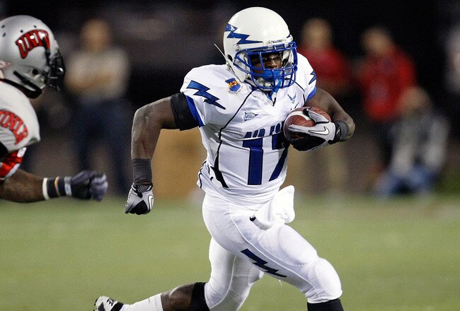 LAS VEGAS - NOVEMBER 18:  Asher Clark #17 of the Air Force Falcons runs for yardage against Mike Grant #17 of the UNLV Rebels during their game at Sam Boyd Stadium November 18, 2010 in Las Vegas, Nevada. Air Force won 35-20.  (Photo by Ethan Miller/Getty Images)