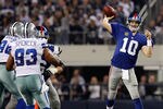 ARLINGTON, TX - DECEMBER 11:  Eli Manning #10 of the New York Giants throws to an open receiver against the Dallas Cowboys at Cowboys Stadium on December 11, 2011 in Arlington, Texas.  (Photo by Tom Pennington/Getty Images)