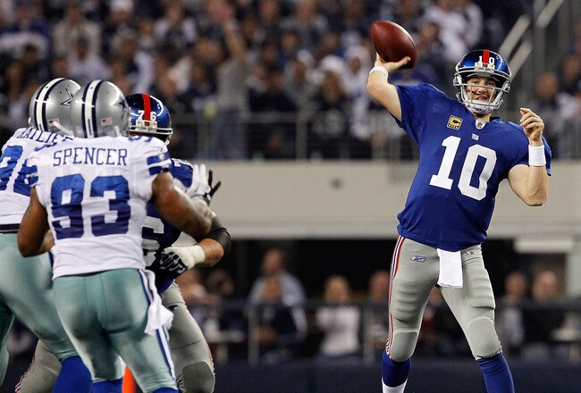ARLINGTON, TX - DECEMBER 11:  Eli Manning #10 of the New York Giants throws to an open receiver against the Dallas Cowboys at Cowboys Stadium on December 11, 2011 in Arlington, Texas.  (Photo by Tom Pennington/Getty Images)