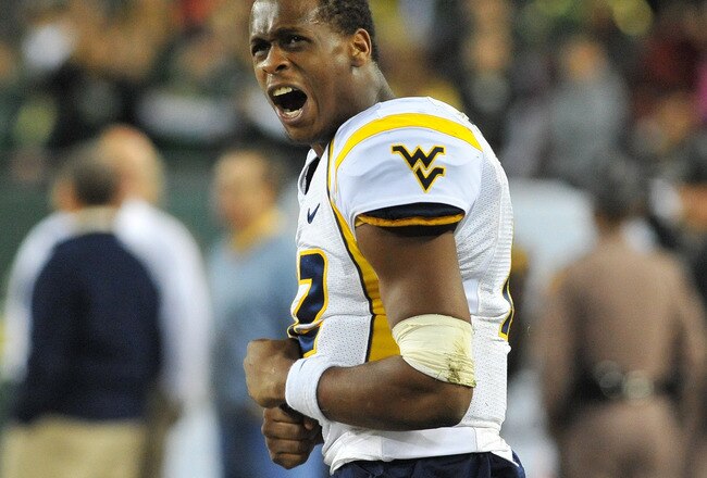 TAMPA, FL - DECEMBER 1:  Quarterback Geno Smith #12 of the  of the West Virginia Mountaineers yells after a turnover against the South Florida Bulls December 1, 2011 at Raymond James Stadium in Tampa, Florida.  West Virgina won 30 - 27. (Photo by Al Messerschmidt/Getty Images)
