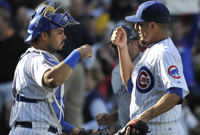 CHICAGO, IL - SEPTEMBER 21: Matt Garza #17 of the Chicago Cubs and Geovany Soto #18 celebrate the Cubs victory against the Milwaukee Brewers on September 21, 2011 at Wrigley Field in Chicago, Illinois. The Cubs defeated the Brewers 7-1  (Photo by David Banks/Getty Images)