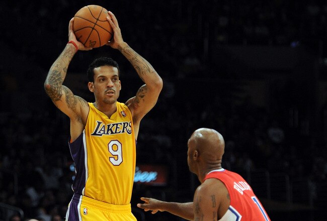 LOS ANGELES, CA - DECEMBER 19:  Matt Barnes #9 of the Los Angeles Lakers looks to pass as he is guarded by Chauncey Billups #1 of the Los Angeles Clippers at Staples Center on December 19, 2011 in Los Angeles, California. NOTE TO USER: User expressly acknowledges and agrees that, by downloading and/or using this Photograph, user is consenting to the terms and conditions of the Getty Images License Agreement. Mandatory Copyright Notice: Copyright 2011 NBAE  (Photo by Harry How/Getty Images)