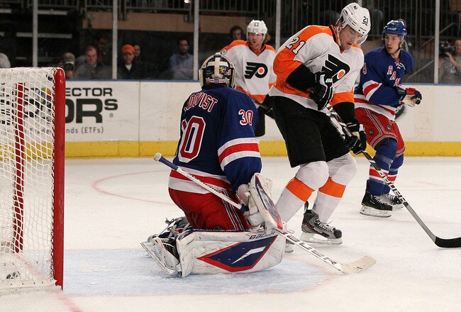 NEW YORK, NY - DECEMBER 23:  Henrik Lundqvist #30 of the New York Rangers surrenders third period goal against Andrej Meszaros #41 of the Philadelphia Flyers (not pictured) as James van Riemsdyk #21 sets up a screen on December 23, 2011 at Madison Square Garden in New York City.  (Photo by Jim McIsaac/Getty Images)