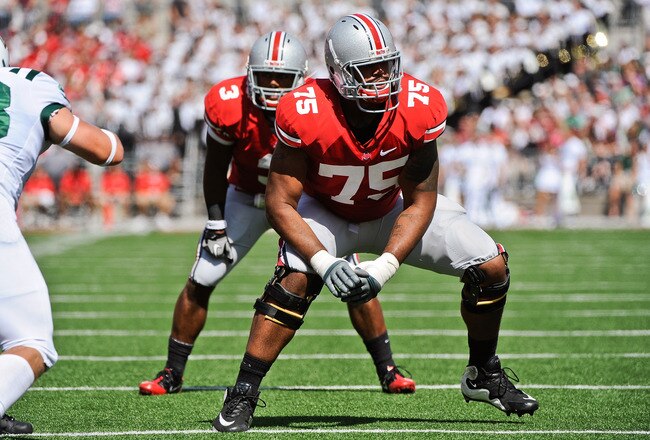 COLUMBUS, OH - SEPTEMBER 18:  Mike Adams #75 of the Ohio State Buckeyes looks for his blocking assignment against the Ohio Bobcats at Ohio Stadium on September 18, 2010 in Columbus, Ohio.  (Photo by Jamie Sabau/Getty Images)