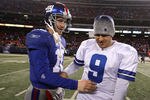 EAST RUTHERFORD, NJ - DECEMBER 06:  Eli Manning #10 of the New York Giants is congratulated by Tony Romo #9 of the Dallas Cowboys after the Giants won 31-24 at Giants Stadium on December 6, 2009 in East Rutherford, New Jersey.  (Photo by Jim McIsaac/Getty Images)