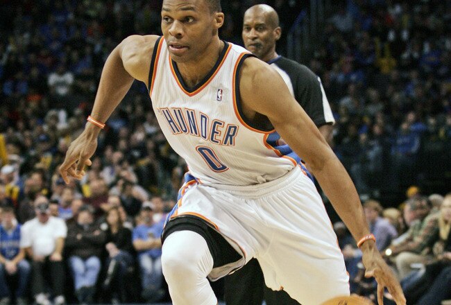 OKLAHOMA CITY, OK -DECEMBER 25:  Russell Westbrook #0 of the Oklahoma City Thunder drives inside during the NBA season opening game against the Orlando Magic December 25, 2011 at the Chesapeake Energy Arena in Oklahoma City, Oklahoma.  Oklahoma City defeated Orlando 97-89. NOTE TO USER: User expressly acknowledges and agrees that, by downloading and or using this Photograph, user is consenting to the terms and conditions of the Getty Images License Agreement.  (Photo by Brett Deering/Getty Images)