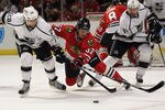 CHICAGO, IL - DECEMBER 28: Brandon Pirri #37 of the Chicago Blackhawks and Jarret Stoll #28 of the Los Angeles Kings battle for the puck at the United Center on December 28, 2011 in Chicago, Illinois.  (Photo by Jonathan Daniel/Getty Images)