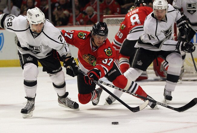 CHICAGO, IL - DECEMBER 28: Brandon Pirri #37 of the Chicago Blackhawks and Jarret Stoll #28 of the Los Angeles Kings battle for the puck at the United Center on December 28, 2011 in Chicago, Illinois.  (Photo by Jonathan Daniel/Getty Images)