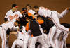 BALTIMORE, MD - SEPTEMBER 28:  Members of the Baltimore Orioles celebrate after defeating the Boston Red Sox 4-3 at Oriole Park at Camden Yards on September 28, 2011 in Baltimore, Maryland.  (Photo by Rob Carr/Getty Images)
