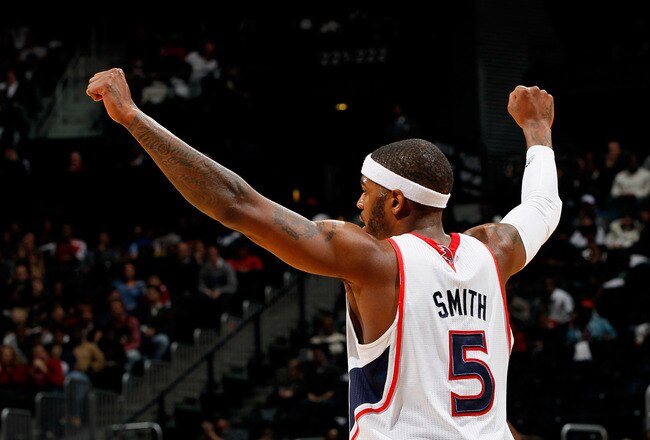 ATLANTA, GA - DECEMBER 28:  Josh Smith #5 of the Atlanta Hawks reacts after a basket against the Washington Wizards at Philips Arena on December 28, 2011 in Atlanta, Georgia.  NOTE TO USER: User expressly acknowledges and agrees that, by downloading and or using this photograph, User is consenting to the terms and conditions of the Getty Images License Agreement.  (Photo by Kevin C. Cox/Getty Images)
