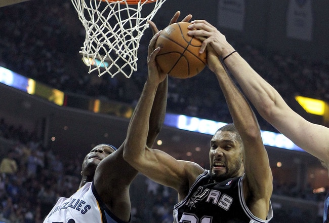 MEMPHIS, TN - APRIL 29:  Zach Randolph #50 and Marc Gasol #33 of the Memphis Grizzlies and Tim Duncan #21 of the San Antonio Spurs reach for a rebound in Game Six of the Western Conference Quarterfinals in the 2011 NBA Playoffs at FedExForum on April 29, 2011 in Memphis, Tennessee. NOTE TO USER: User expressly acknowledges and agrees that, by downloading and/or using this Photograph, User is consenting to the terms and conditions of the Getty Images License Agreement.  (Photo by Andy Lyons/Getty Images)
