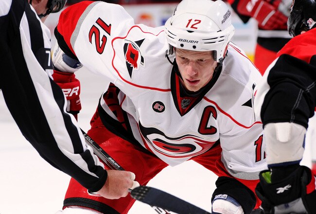 OTTAWA, ON - NOVEMBER 27:  Eric Staal #12 of the Carolina Hurricanes watches intently at a faceoff  in a game against the Ottawa Senators at Scotiabank Place on November 27, 2011 in Ottawa, Canada.  (Photo by Phillip MacCallum/Getty Images)