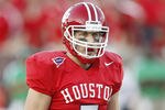 HOUSTON - OCTOBER 22:  Houston Cougar quarterback Case Keenum has broken the NCAA's career total offense record to become the Football Bowl Subdivision's all-time leader in total offense in the first quarter of today's game against Marshall Thndering Herd at Robertson Stadium on October 22, 2011 in Houston, Texas.  (Photo by Bob Levey/Getty Images)
