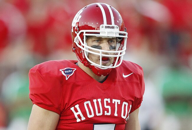 HOUSTON - OCTOBER 22:  Houston Cougar quarterback Case Keenum has broken the NCAA's career total offense record to become the Football Bowl Subdivision's all-time leader in total offense in the first quarter of today's game against Marshall Thndering Herd at Robertson Stadium on October 22, 2011 in Houston, Texas.  (Photo by Bob Levey/Getty Images)