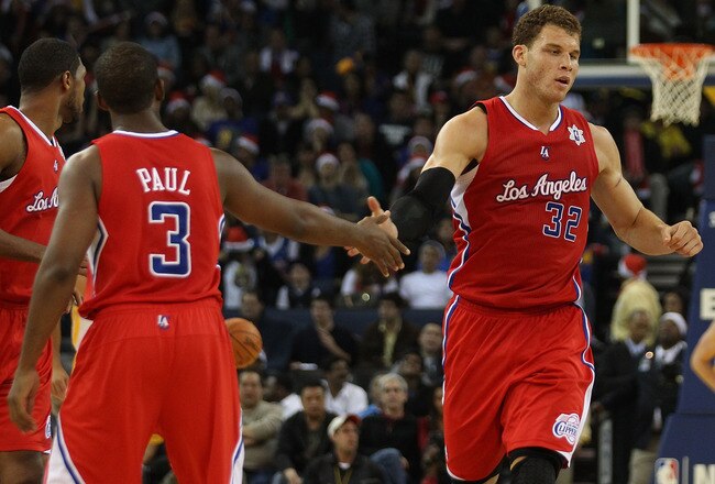 OAKLAND, CA - DECEMBER 25:  Blake Griffin #32 of the Los Angeles Clippers celebrates with Chris Paul #3 against Golden State Warriors during the season opener at Oracle Arena on December 25, 2011 in Oakland, California.  NOTE TO USER: User expressly acknowledges and agrees that, by downloading and or using this photograph, User is consenting to the terms and conditions of the Getty Images License Agreement.  (Photo by Jed Jacobsohn/Getty Images)