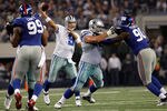 ARLINGTON, TX - DECEMBER 11:   Tony Romo #9 of the Dallas Cowboys looks for an open receiver against the New York Giants at Cowboys Stadium on December 11, 2011 in Arlington, Texas.  (Photo by Tom Pennington/Getty Images)