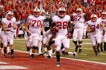 INDIANAPOLIS, IN - DECEMBER 03:  Montee Ball #28 of the Wisconsin Badgers celebrates along with his teammates afte he scored his second 6-yard rushing touchdown in the first quarter against the Michigan State Spartans during the Big 10 Conference Championship Game at Lucas Oil Stadium on December 3, 2011 in Indianapolis, Indiana.  (Photo by Gregory Shamus/Getty Images)