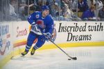 25 Nov 1992:  Rightwinger Andrei Kovalenko of the Quebec Nordiques moves the puck during a game against the Buffalo Sabres at Memorial Auditorium in Buffalo, New York. Mandatory Credit: Rick Stewart  /Allsport