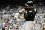 SAN DIEGO, CA - JULY 29:  Seth Smith #7 of the Colorado Rockies connects for a single in the second inning of a baseball game against the San Diego Padres at Petco Park on July 29, 2011 in San Diego, California.  (Photo by Denis Poroy/Getty Images)