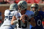 DALLAS, TX - DECEMBER 30:  Riley Nelson #13 of the Brigham Young Cougars throws against the Brigham Young Cougars during the Bell Helicopter Armed Forces Bowl at Gerald J. Ford Stadium on December 30, 2011 in Dallas, Texas.  (Photo by Ronald Martinez/Getty Images)
