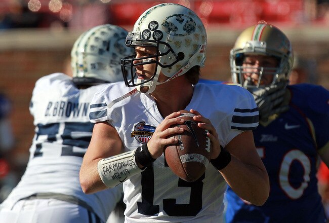 DALLAS, TX - DECEMBER 30:  Riley Nelson #13 of the Brigham Young Cougars throws against the Brigham Young Cougars during the Bell Helicopter Armed Forces Bowl at Gerald J. Ford Stadium on December 30, 2011 in Dallas, Texas.  (Photo by Ronald Martinez/Getty Images)