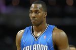 CHARLOTTE - APRIL 24:  Center Dwight Howard #12 of the Orlando Magic collects himself before a free throw attempt during Game Three of the Eastern Conference Quarterfinals against the Charlotte Bobcats during the 2010 NBA Playoffs at Time Warner Cable Arena on April 24, 2010 in Charlotte, North Carolina. NOTE TO USER: User expressly acknowledges and agrees that, by downloading and/or using this photograph, user is consenting to the terms and conditions of the Getty Images License Agreement.  The Magic beat the Bobcats 90-86.  (Photo by Mike Zarrilli/Getty Images)