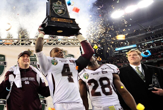 NASHVILLE, TN - DECEMBER 30:  Coach Dan Mullen, Charles Mitchell #4 and Vick Ballard #28 of the Mississippi State Bulldogs celebrate after a win over the Wake Forest Demon Deacons during at the Franklin American Mortgage Music City Bowl at LP Field on December 30, 2011 in Nashville, Tennessee. Mississippi State won 23-17.  (Photo by Grant Halverson/Getty Images)