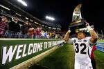 NASHVILLE, TN - DECEMBER 30:  Marcus Green #32 of the Mississippi State Bulldogs celebrates with the trophy after a win over the Wake Forest Demon Deacons during the Franklin American Mortgage Music City Bowl at LP Field on December 30, 2011 in Nashville, Tennessee. Mississippi State won 23-17.  (Photo by Grant Halverson/Getty Images)