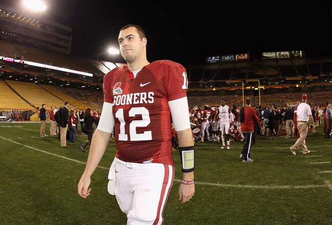 TEMPE, AZ - DECEMBER 30:  Quarterback Landry Jones #12 of the Oklahoma Sooners walks off the field after defeating the Iowa Hawkeyes in the Insight Bowl at Sun Devil Stadium on December 30, 2011 in Tempe, Arizona. The Sooners defeated the Hawkeyes 31-14. (Photo by Christian Petersen/Getty Images)