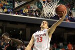 GREENSBORO, NC - MARCH 10:  Sammy Zeglinski #13 of the Virginia Cavaliers shoots against Durand Scott #1 of the Miami Hurricanes during the first half of the first round of the 2011 ACC men's basketball tournament at the Greensboro Coliseum on March 10, 2011 in Greensboro, North Carolina.  (Photo by Streeter Lecka/Getty Images)