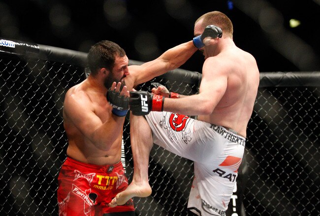 MONTREAL- MAY 8: TJ Grant (R) knees Johny Hendricks in their welterweight bout at UFC 113 at Bell Centre on May 8, 2010 in Montreal, Quebec, Canada.  (Photo by Richard Wolowicz/Getty Images)