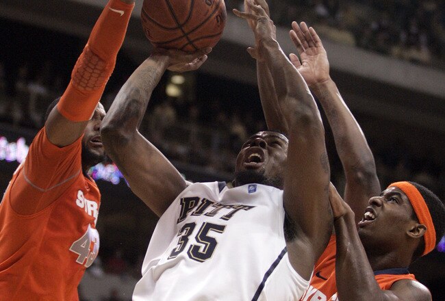 PITTSBURGH, PA - JANUARY 17:  Nasir Robinson #35 of the Pittsburgh Panthers battles his way to the hoop against James Southerland #43 and C.J. Fair #5 of the Syracuse Orange at Petersen Events Center on January 17, 2011 in Pittsburgh, Pennsylvania.  The Panthers defeated the Orange 74-66.  (Photo by Justin K. Aller/Getty Images)